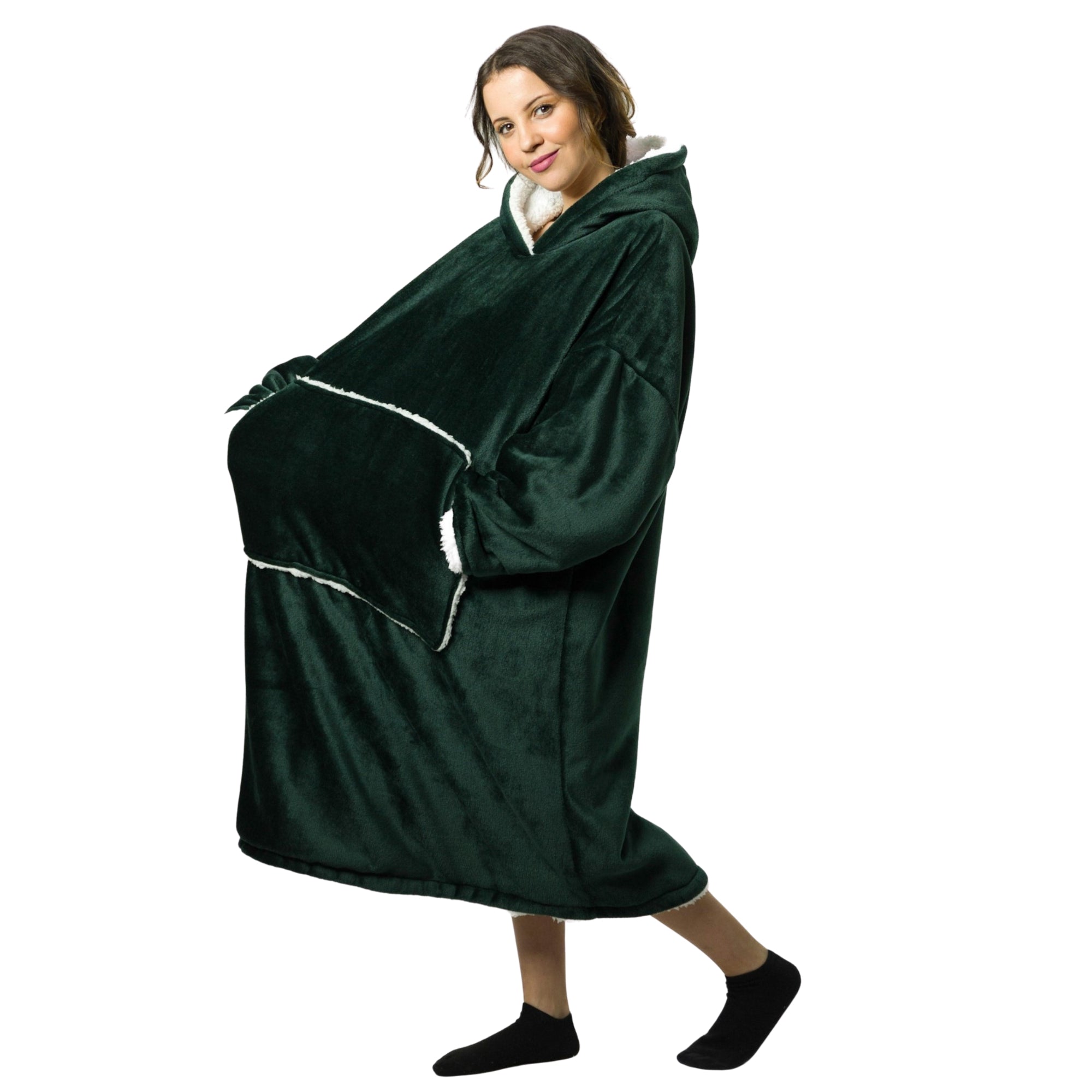 Person wearing a green hooded blanket on a white background